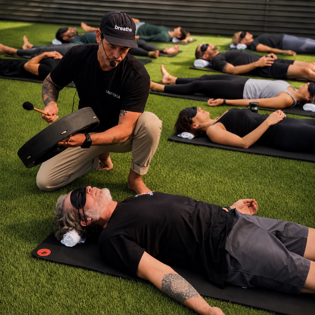 Michael Thomas guiding a breathwork session with a sound bowl